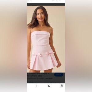 Altar'd State Kailynn strapless bow romper in pink. X-Large